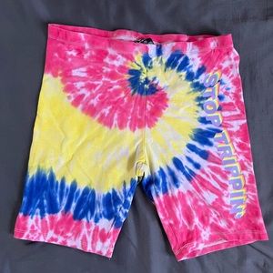 tie dye “stop trippin” biker shorts